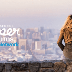 Photo: SuperMums logo with woman looking at a city skyline in the distance.