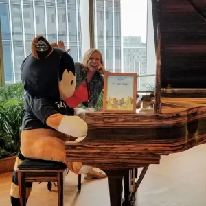 Photo: Salesforce Mascot Astro Plays the Piano