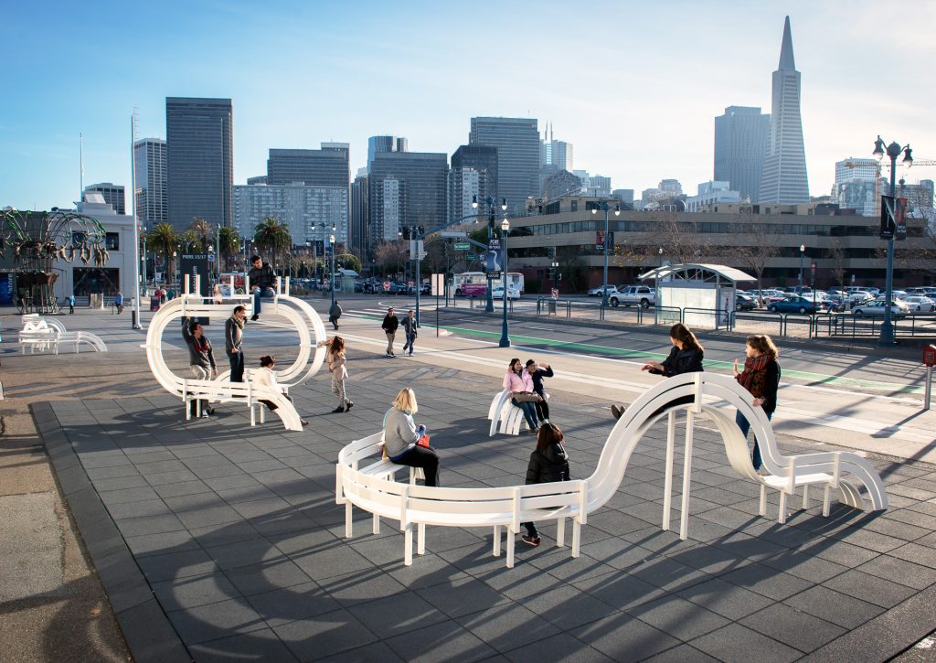 Photo: Exterior outdoor installation at the Exploratorium with the San Francisco skyline in the background.