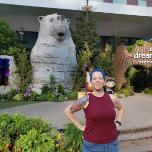 Photo of Skye Tyler in front of bear statue at Dreamforce 21