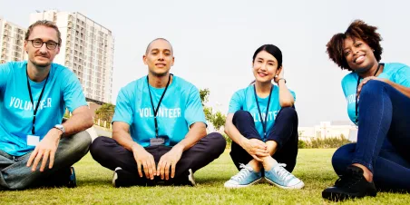 Group of volunteers sitting outdoors