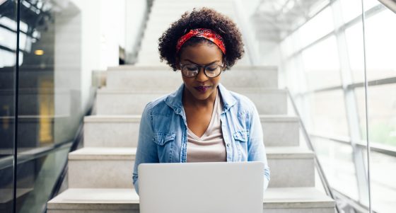 Young professional Black woman working on a laptop