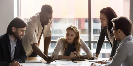 Team collaborating around boardroom table