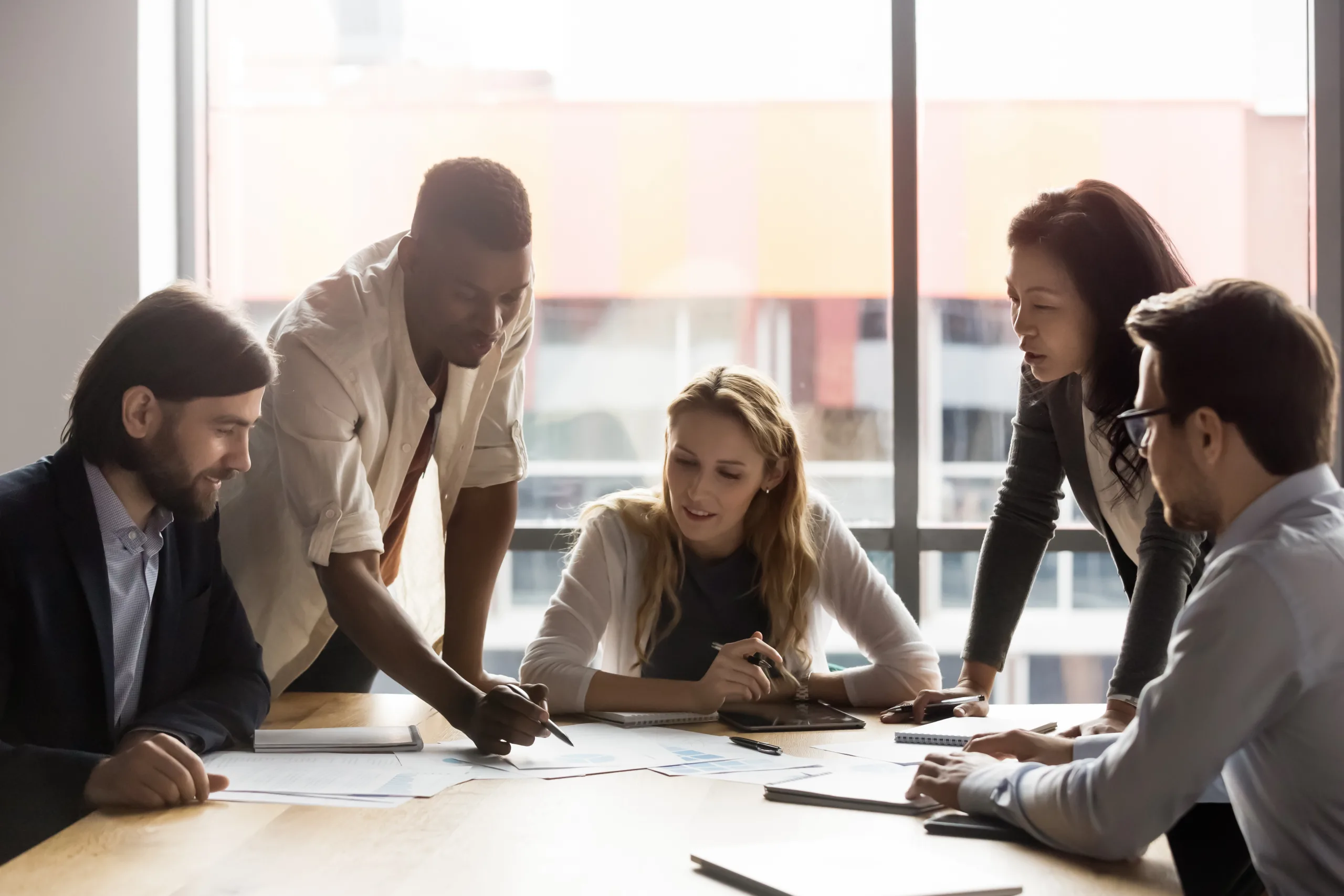 Team collaborating around boardroom table